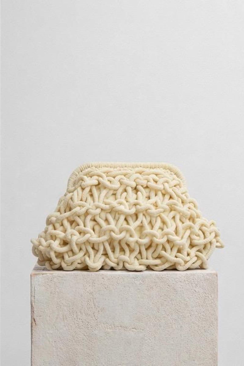Small rope clutch bag in egg white from Folklore The Label, featuring a compact design with a minimalist rope strap.