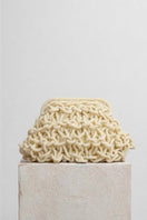 Small rope clutch bag in egg white by Folklore The Label, featuring a minimalist design and compact size.