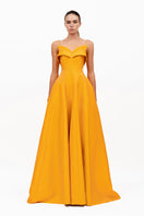 Bright orange Soleil dress by Moon Hakaan Yildirim featuring a flowing gown design and elegant silhouette.