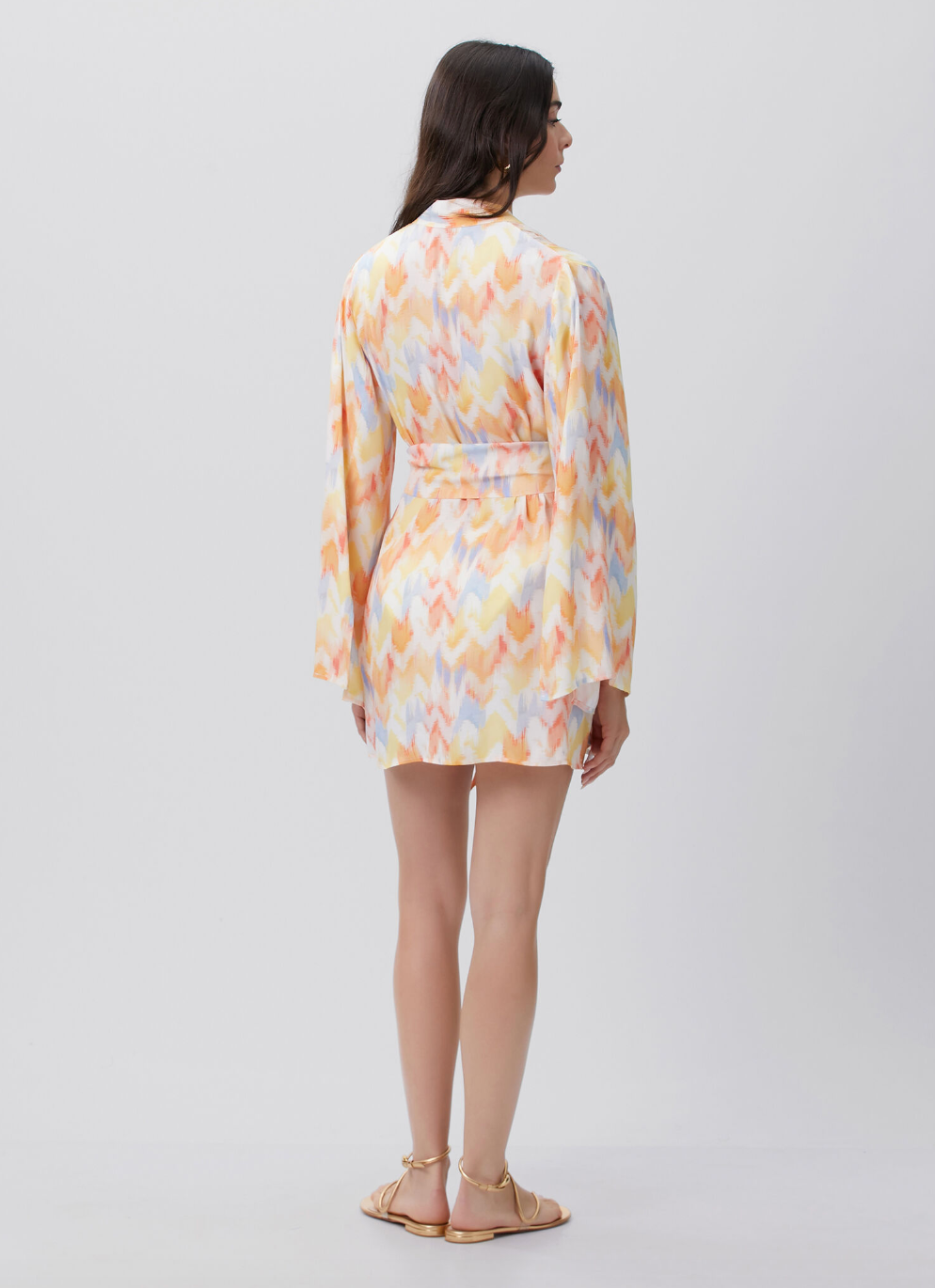 Maliluha Soleil Caftan cover-up in vibrant fabric, flowing design with wide sleeves and intricate patterns, perfect for beachwear.