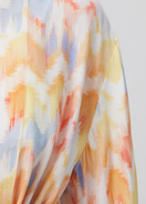 Maliluha Soleil Caftan cover-up with vibrant patterns and flowing fabric, perfect for beach or resort wear.