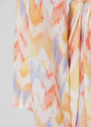 Maliluha Soleil Caftan cover-up featuring flowing fabric, vibrant patterns, and a relaxed fit ideal for beach or poolside wear.
