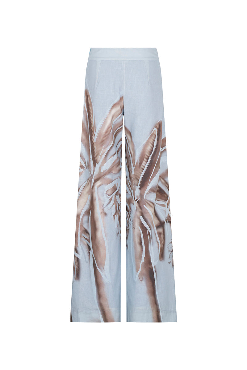 Tinta Latina Solei pants in soft blue print, stylish and comfortable women's pants with vibrant pattern, shown on a model.