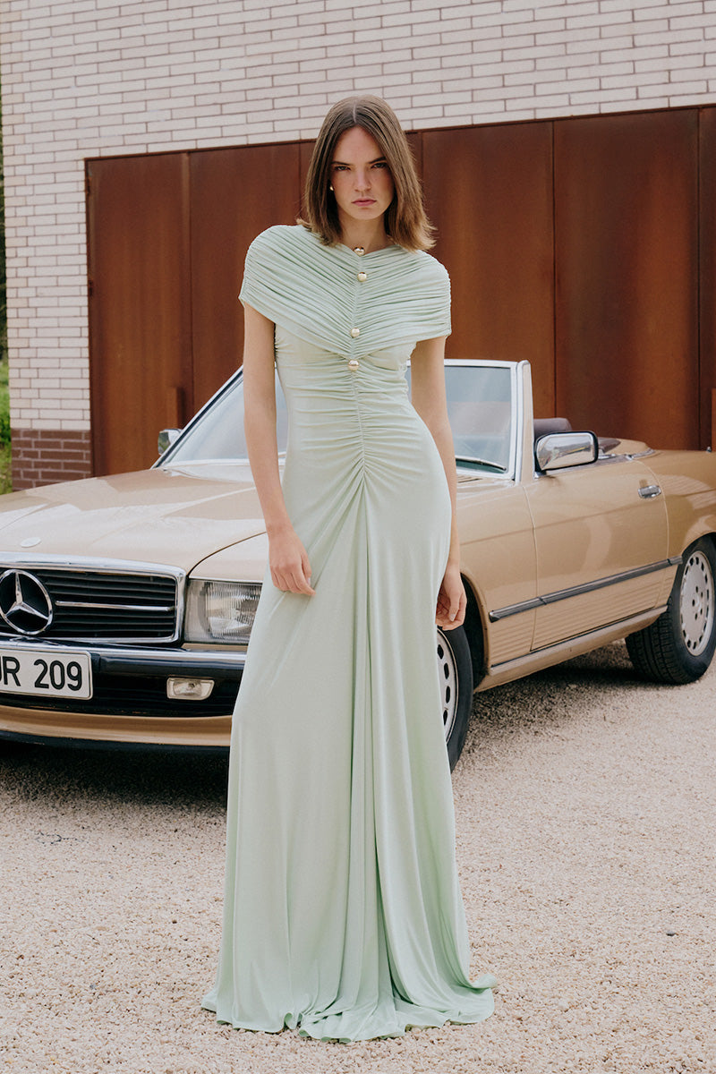 Light mint green maxi dress from Gigii's Solita collection, featuring a flowing, elegant design perfect for summer occasions.