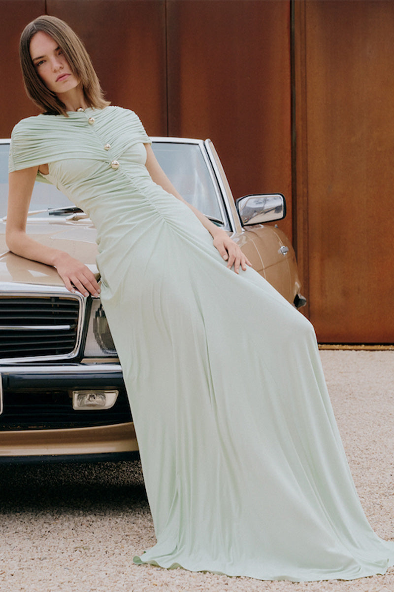 Mint green Solita maxi dress by Gigii's, flowing fabric and elegant design, shown on a model.