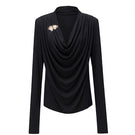 Black SONIQ top by Jenny K Tran featuring a stylish, fitted design, shown on a model with a sleek, modern look.