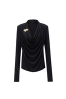 Black SONIQ top by Jenny K Tran featuring a stylish, fitted design, shown on a model with a sleek, modern look.