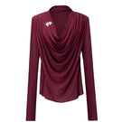Jenny K Tran Soniq Top in burgundy, stylish women’s blouse with long sleeves and a relaxed fit, displayed on a hanger.