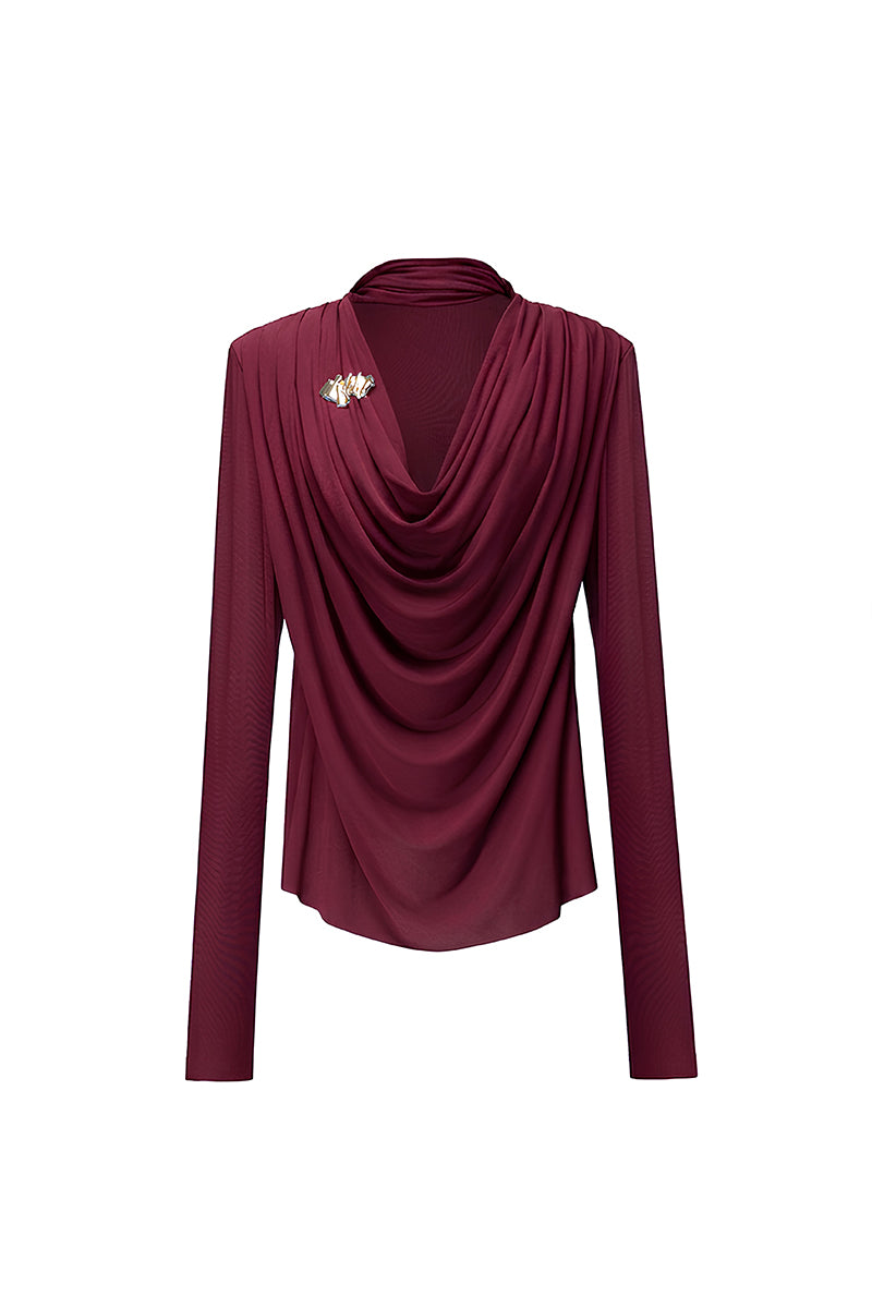 Jenny K Tran Soniq Top in burgundy, stylish women’s blouse with long sleeves and a relaxed fit, displayed on a hanger.