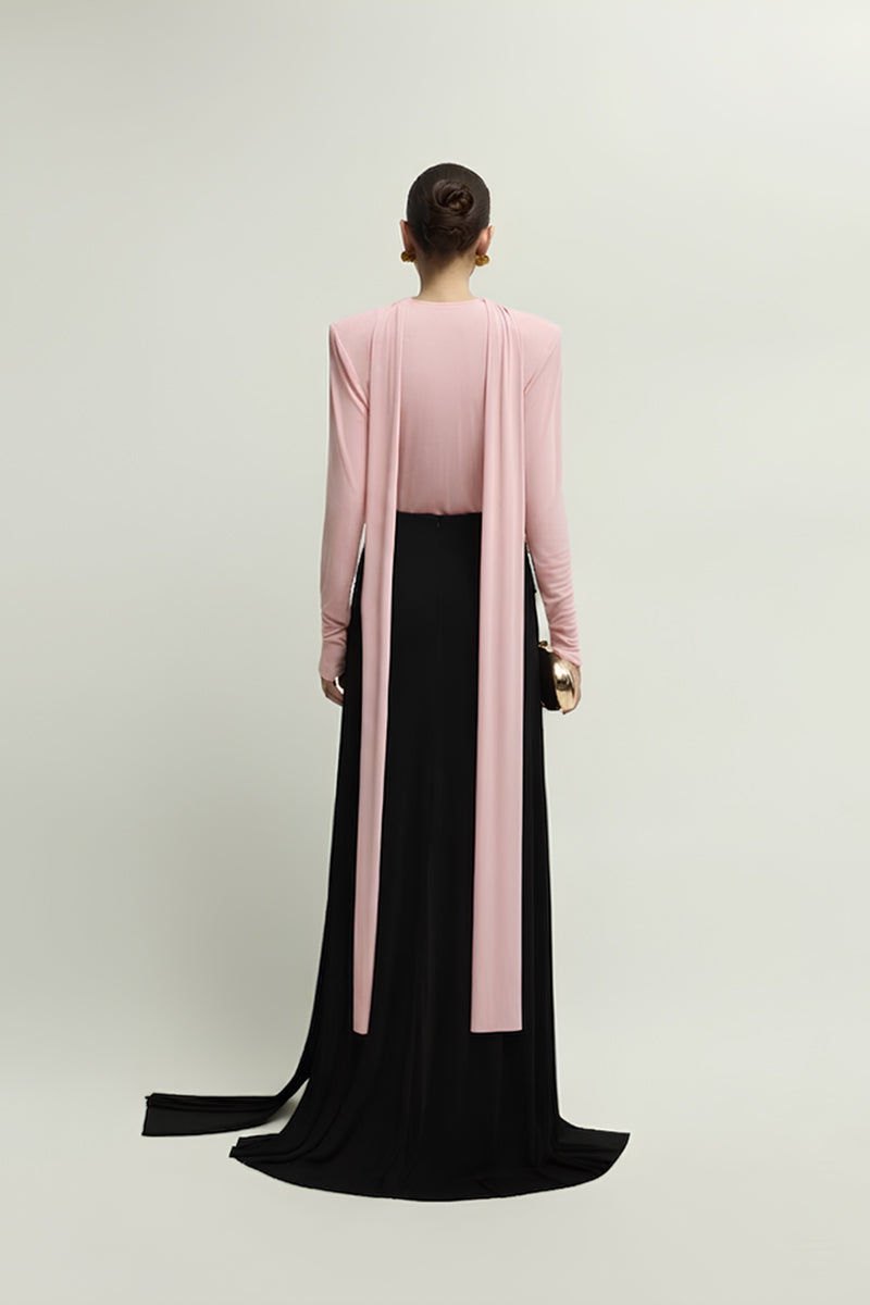 Jenny K Tran Soniq top in baby pink, stylish women's sleeveless blouse with a flowy design, shown on a model.