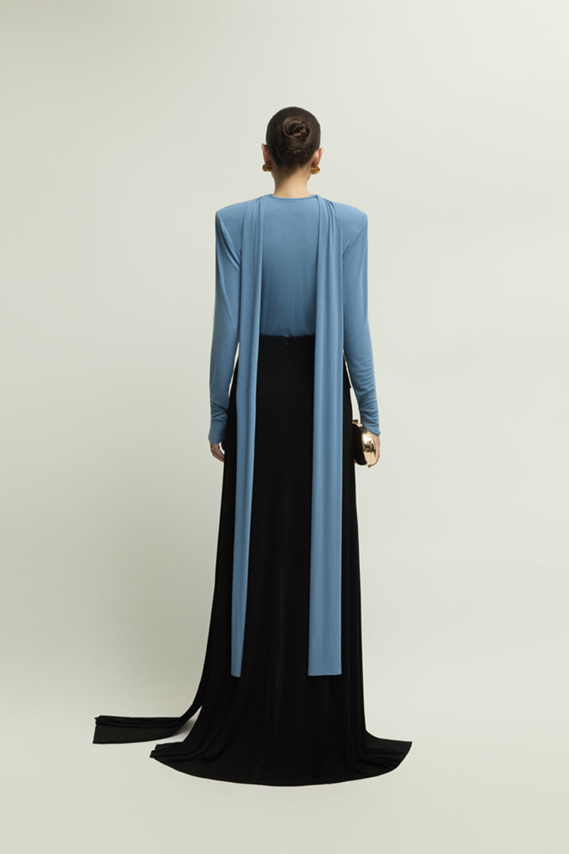 Black DENVIL maxi skirt by Jenny K Tran, flowing fabric with a high waist and elegant design, shown on a model.