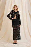 Black Scarlett Gasque Sovereign Maxi Skirt shown from the front, flowing design, and mid-length style.