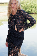 Black Sovereign top by Scarlett Gasque displayed on a model, showcasing its stylish design and fit.