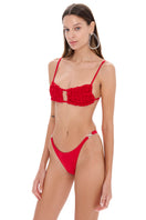 Selia Richwood LIA Red Bikini featuring a stylish, vibrant red design with adjustable straps on a model.