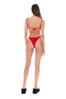 Red Selia Richwood bikini top and bottom set with adjustable straps, styled on a model showcasing a fashionable swimwear look.