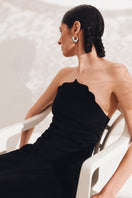 Black Saray midi dress by PODYH featuring a sleek, elegant design with a fitted silhouette and stylish neckline.
