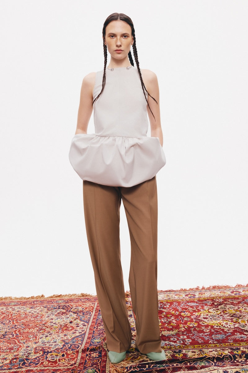 Gray Minaret top by PODYH, featuring a stylish design, shown on a model with a close-up view of the fabric and fit.