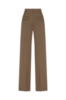 Beige Kemer pants by Podyh, showing a close-up of the tailored waistband and fabric texture.