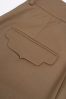 Beige PODYH KEMER pants featuring a tailored fit, shown on a model with side view, highlighting their stylish and comfortable design.