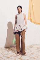 Beige Podyh Kemer pants with tailored fit, featuring front pockets and belt loops, displayed on a plain background.