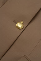 Podyh beige Kemer jacket displayed on a hanger with front view, showcasing its stylish design and neutral color.