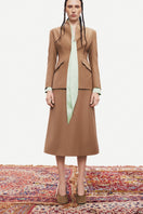 PODYH beige Kemer jacket displayed on a mannequin, showcasing a stylish and lightweight jacket design.