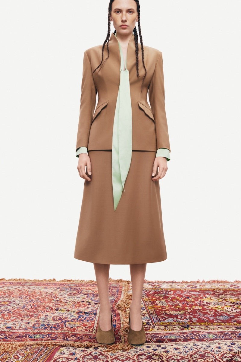 PODYH beige Kemer jacket displayed on a mannequin, showcasing a stylish and lightweight jacket design.