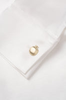 White YAPRAQ blouse from PODYH, a stylish shirt with a clean, elegant design, shown on a hanger with fabric details visible.