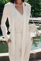 White PODYH YAPRAQ blouse shirt with long sleeves and a classic fit, shown on a hanger against a neutral background.