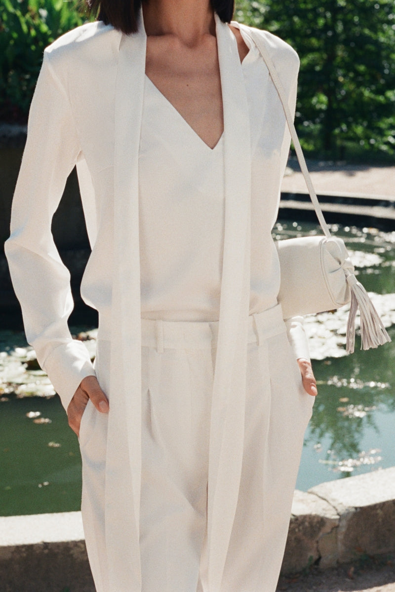 White PODYH YAPRAQ blouse shirt with long sleeves and a classic fit, shown on a hanger against a neutral background.