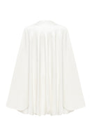 White PODYH GUL cape coat displayed on a hanger, showcasing its stylish design and fabric texture.