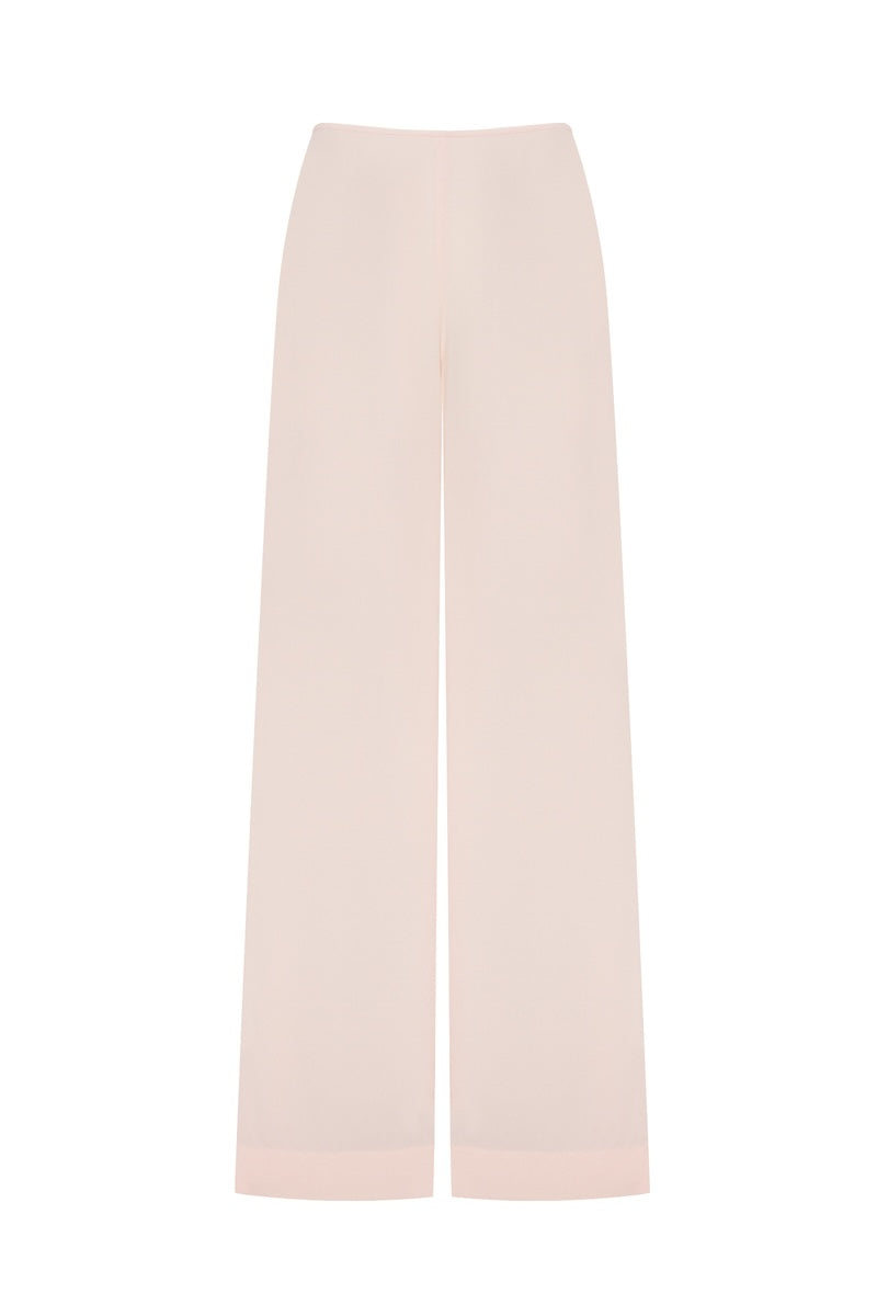 Pink Minaret pants by Podyh, featuring a stylish and comfortable design, shown on a model with relaxed fit and vibrant color.