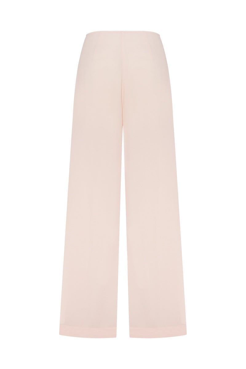 Pink Minaret pants by Podyh featuring a relaxed fit and stylish design, shown on a model.