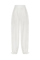 White Shalvar pants by Podyh featuring traditional loose fit and comfortable fabric, shown on a model.