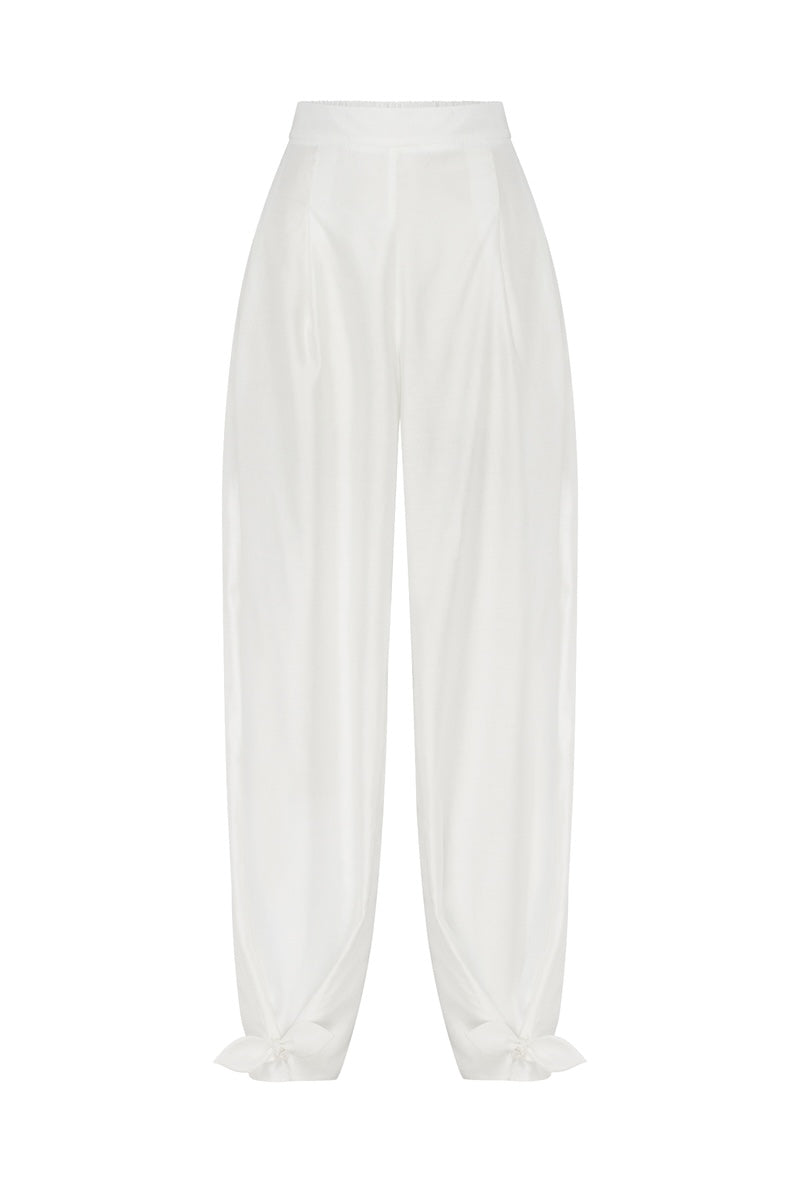 White Shalvar pants by Podyh featuring traditional loose fit and comfortable fabric, shown on a model.