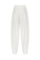 White Shalvar pants by PODYH, featuring traditional loose-fitting design with elastic waistband and intricate embroidery details.