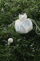 PODYH NAR clutch bag in eggshell color, sleek and compact with a smooth finish, perfect for evening and special occasions.
