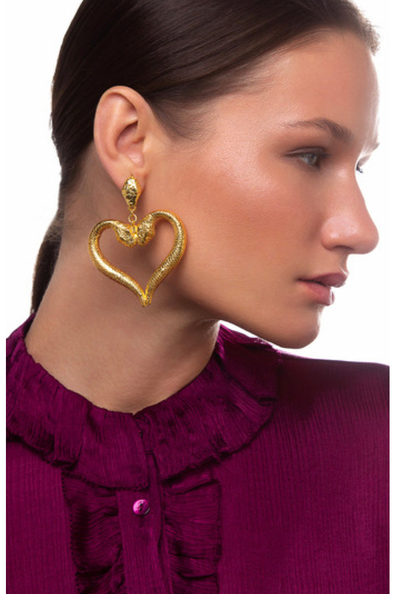 Natia x Lako snake-shaped heart earrings featuring sleek silver design, perfect for stylish and unique jewelry accessories.