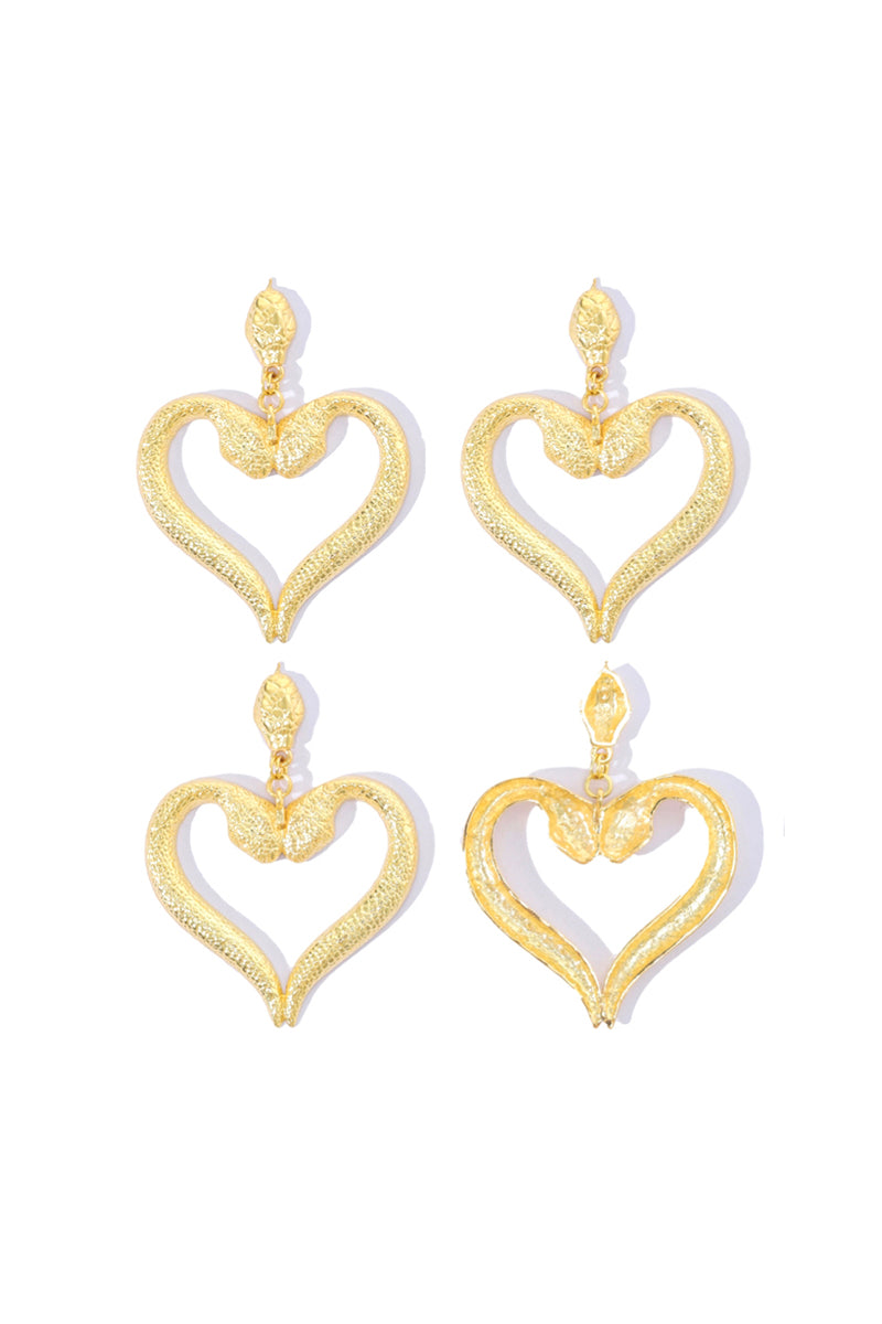 Silver snake-shaped heart earrings from Natia x Lako featuring intricate design and dangling snake motif.