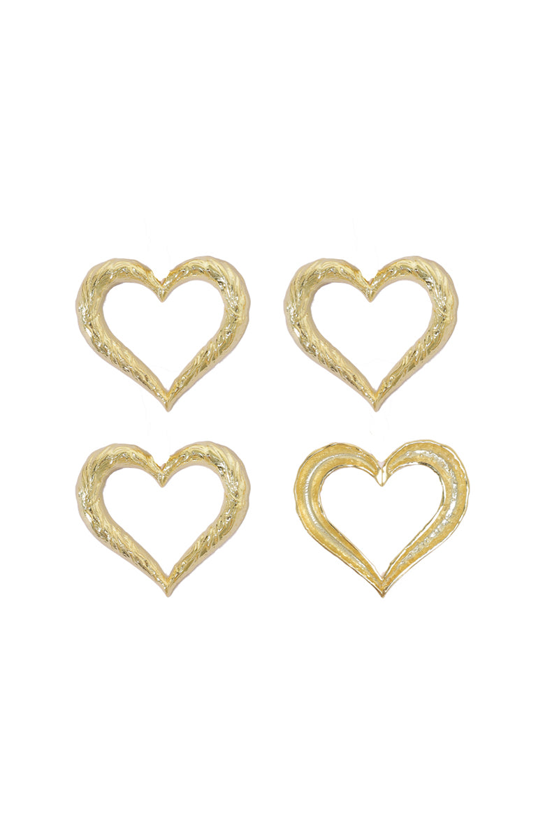 Heart-shaped earrings from Natia x Lako featuring delicate metal design and polished finish, perfect for elegant accessories.
