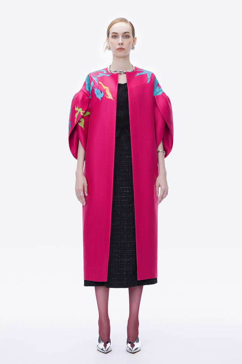 Hand-painted pink coat by Tiny Ink featuring an abstract design, displayed on a hanger against a neutral background.