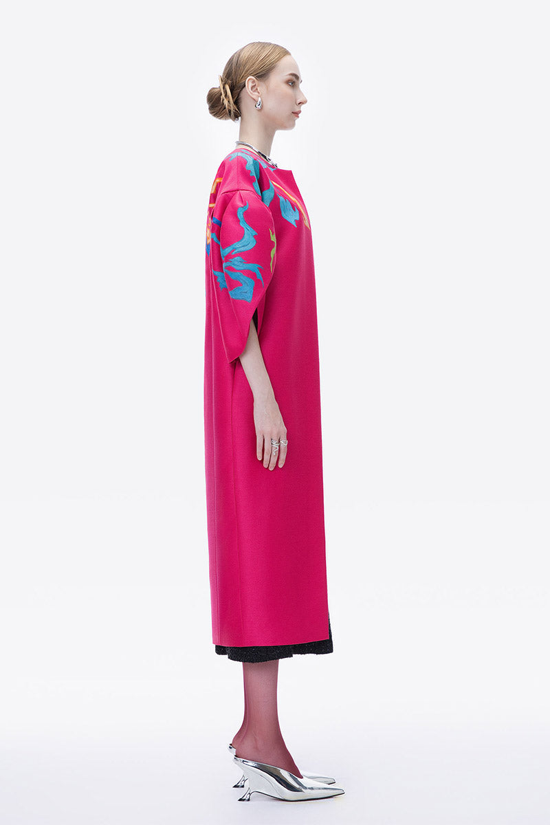 Hand-painted pink bush coat by Tiny Ink, featuring abstract floral design, displayed on a hanger with vibrant colors.