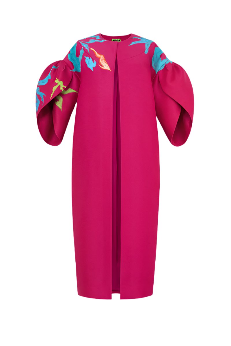 Hand-painted pink coat by Tiny Ink featuring abstract design, shown hanging on a display.