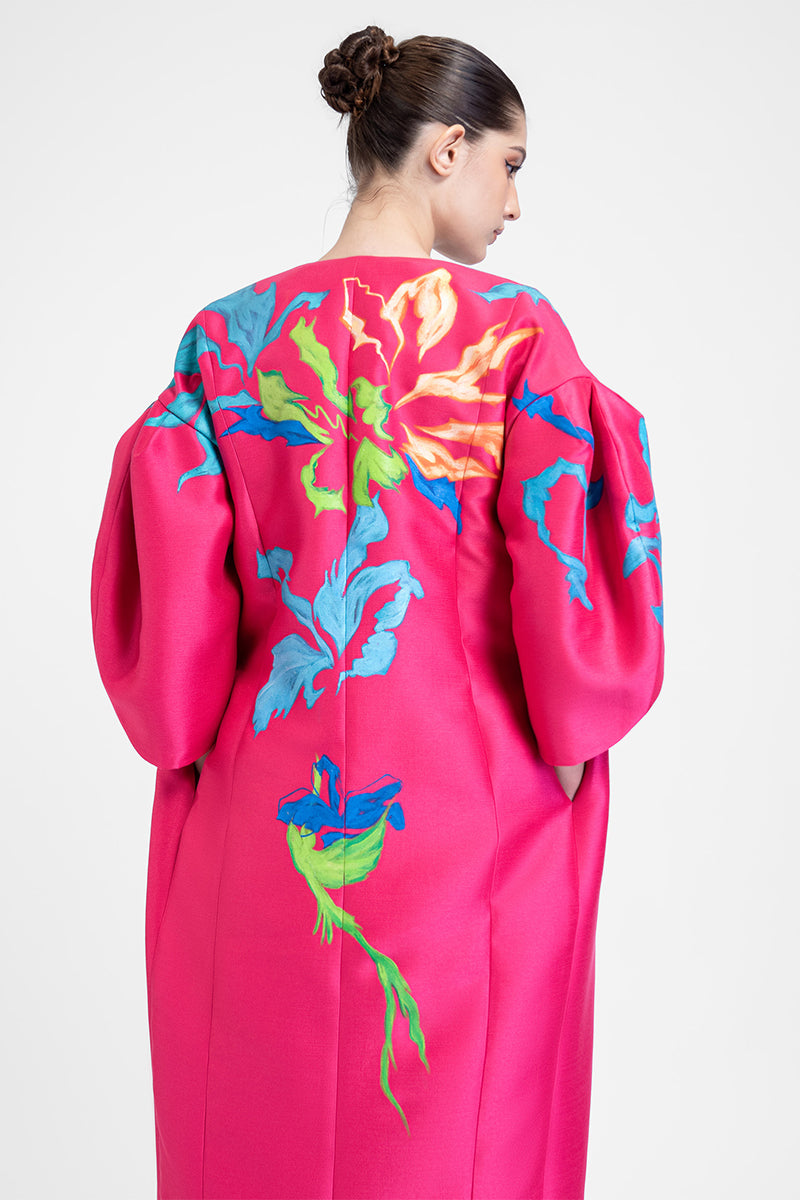 Hand-painted pink bush coat by Tiny Ink, featuring abstract floral design on a stylish coat.
