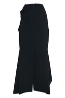 Sean Sheila deconstructed black maxi skirt displayed from the back view, featuring a flowing silhouette and modern design details.