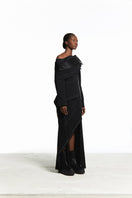 Sean Sheila deconstructed black top with back opening, stylish sleeveless design, shown from the side.