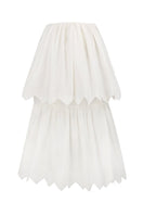 White tiered midi skirt by PODYH featuring a flowing design and multiple layered tiers, perfect for casual or dressy occasions.