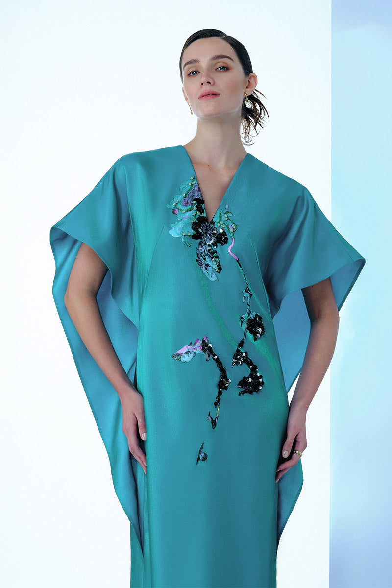 Blue Himalayan Poppy dress by Tiny Ink, a flowing maxi dress with floral print, perfect for summer wear.