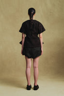 Sean Sheila black embroidery kimono top with intricate embroidery, featuring flowing fabric and wide sleeves, shown from the back.
