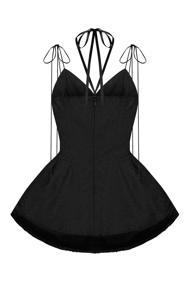 Black balloon hem top by Sean Sheila, showcasing a relaxed fit with balloon-style sleeves and a stylish hem detail.
